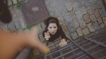 high angle photo of woman on ladder