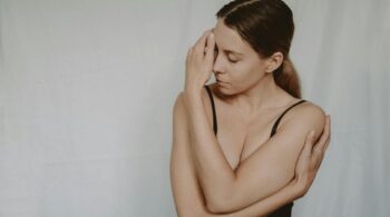 woman in underwear touching face in studio