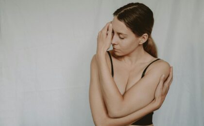 woman in underwear touching face in studio