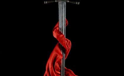 dagger with a blade wrapped in red silk