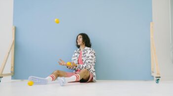 man juggling lemons