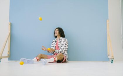 man juggling lemons